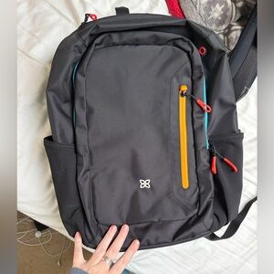 Sherpani Black Backpack with Orange and Blue Accents